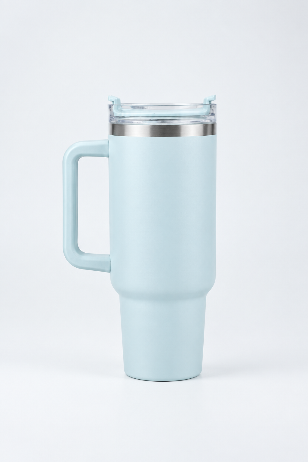 Light-blue tumbler on a pale studio tabletop