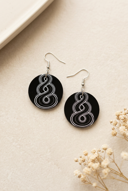 Soft warm photograph of your round black and white earrings